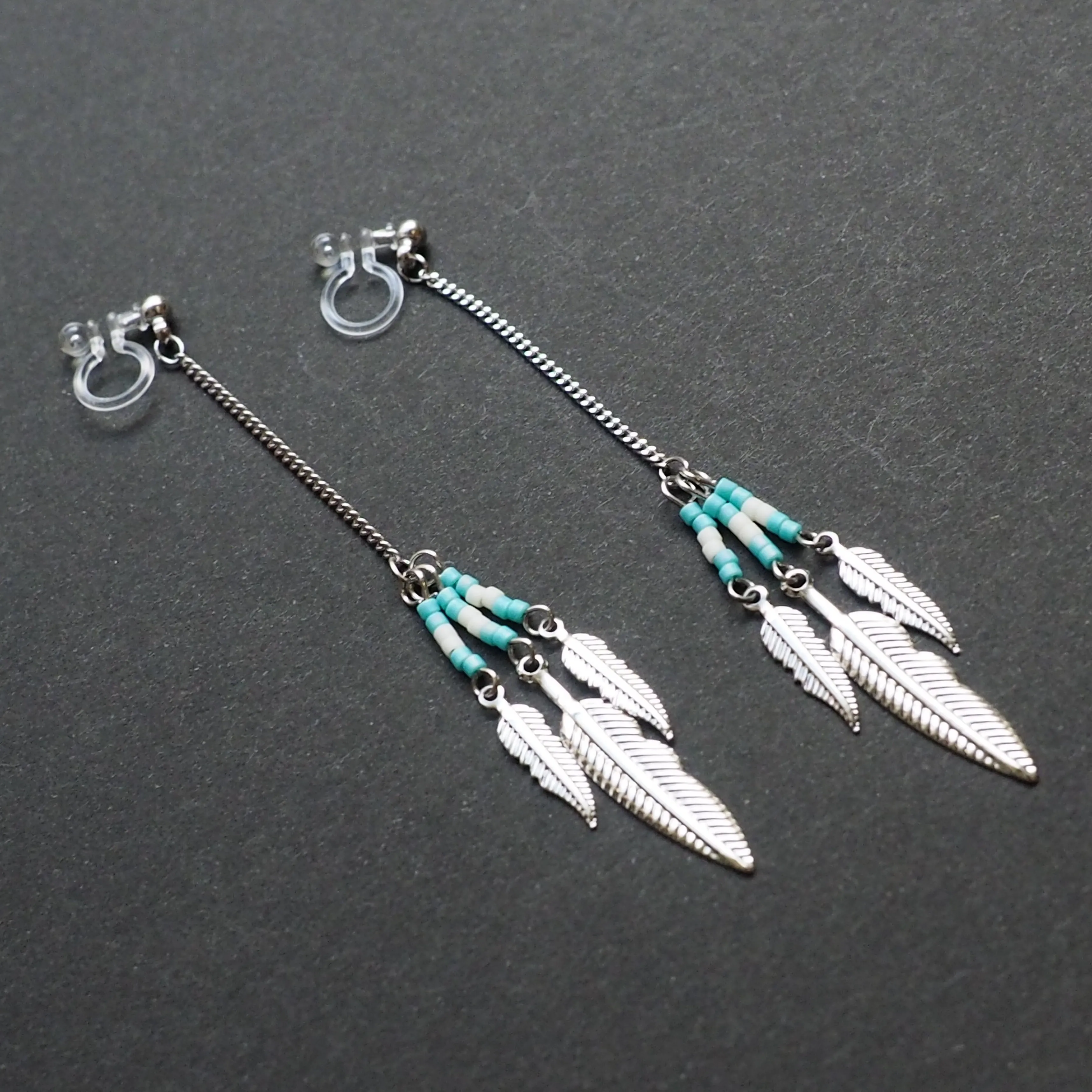 Long feather motif invisible clip on earrings ( Silver tone )