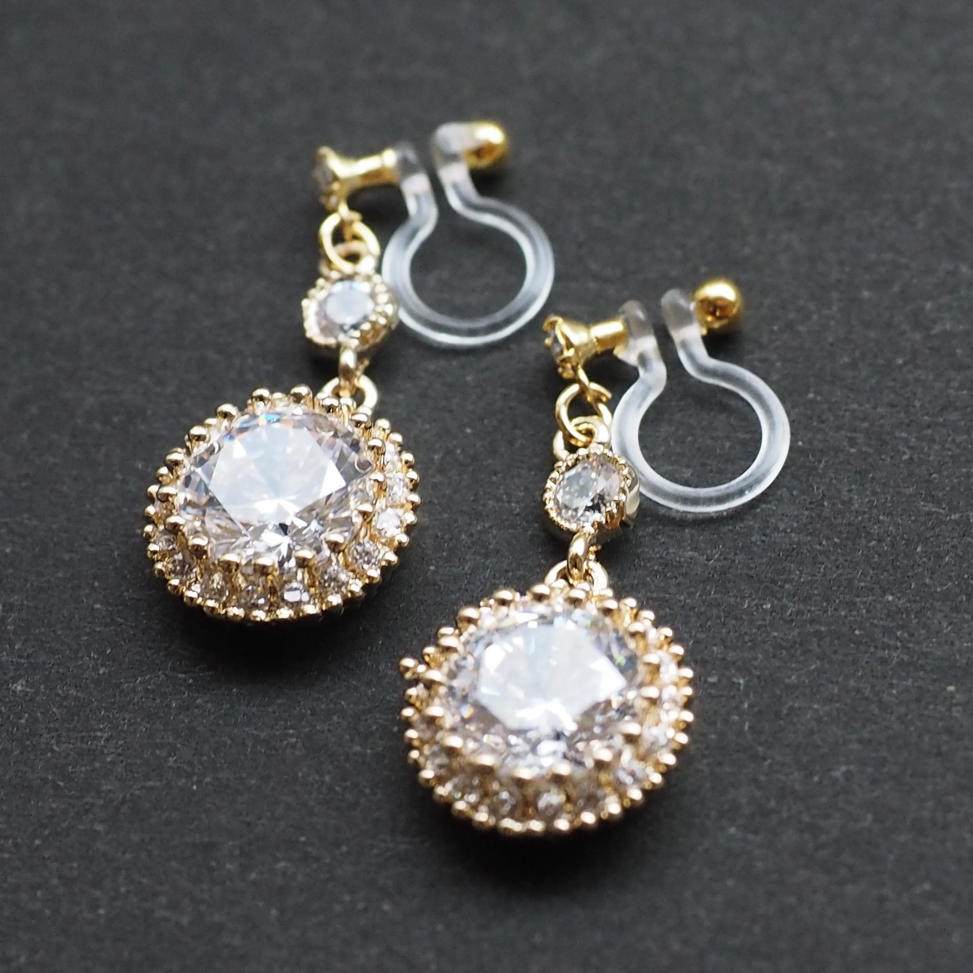 Round cubic zirconia invisible clip on earrings ( gold tone )