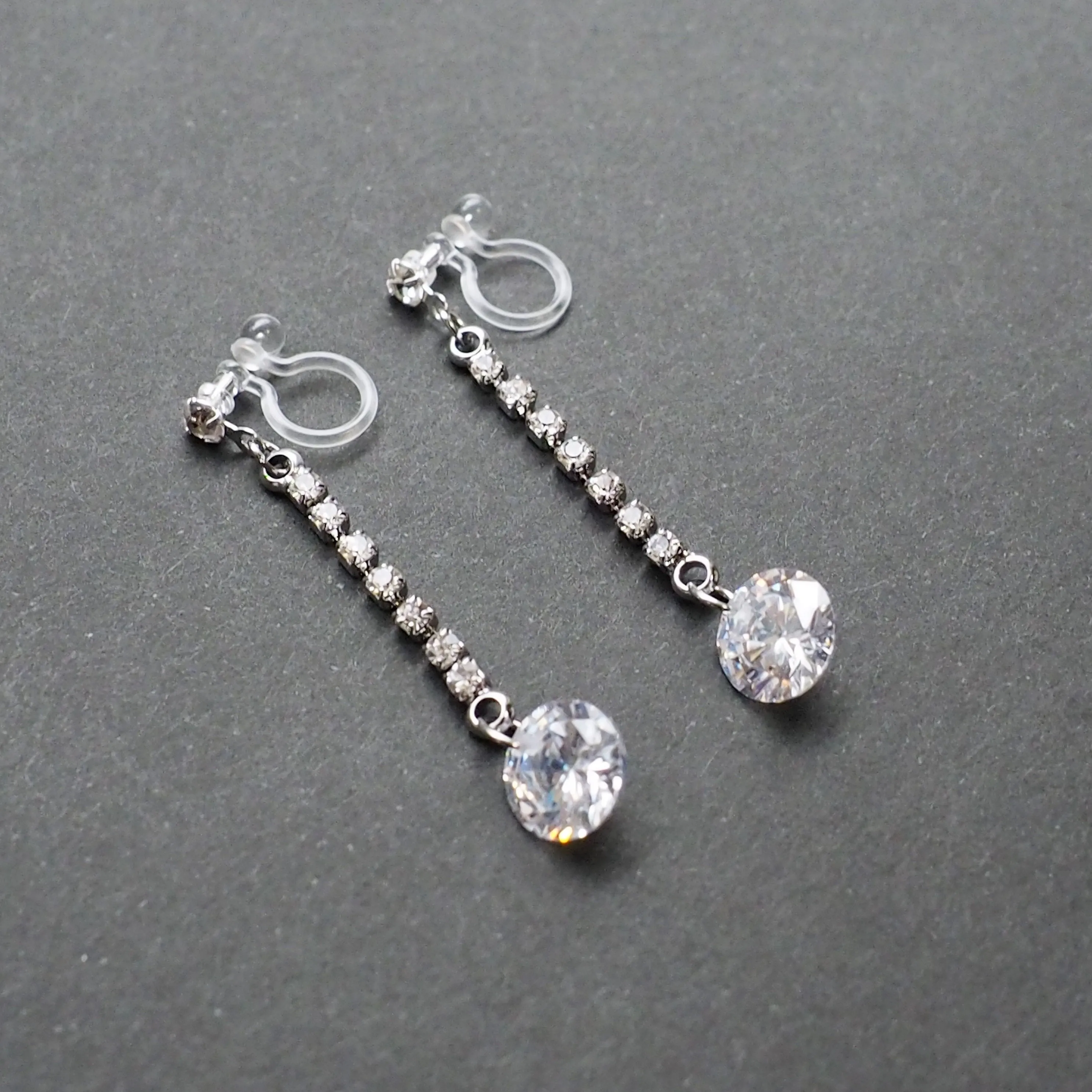 Silver cubic zirconia crystal dangle invisible clip on earrings
