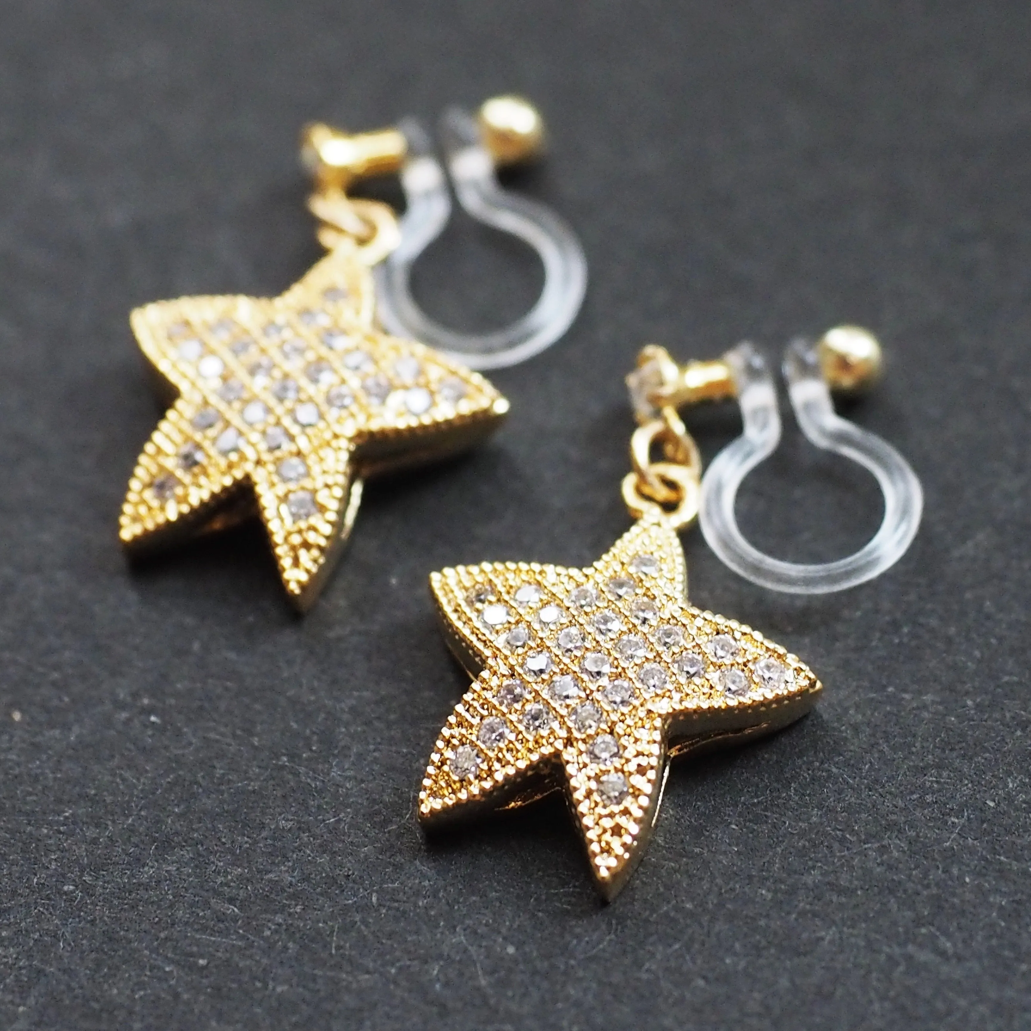 Star micro pave cubic zirconia invisible clip on earrings ( gold tone )