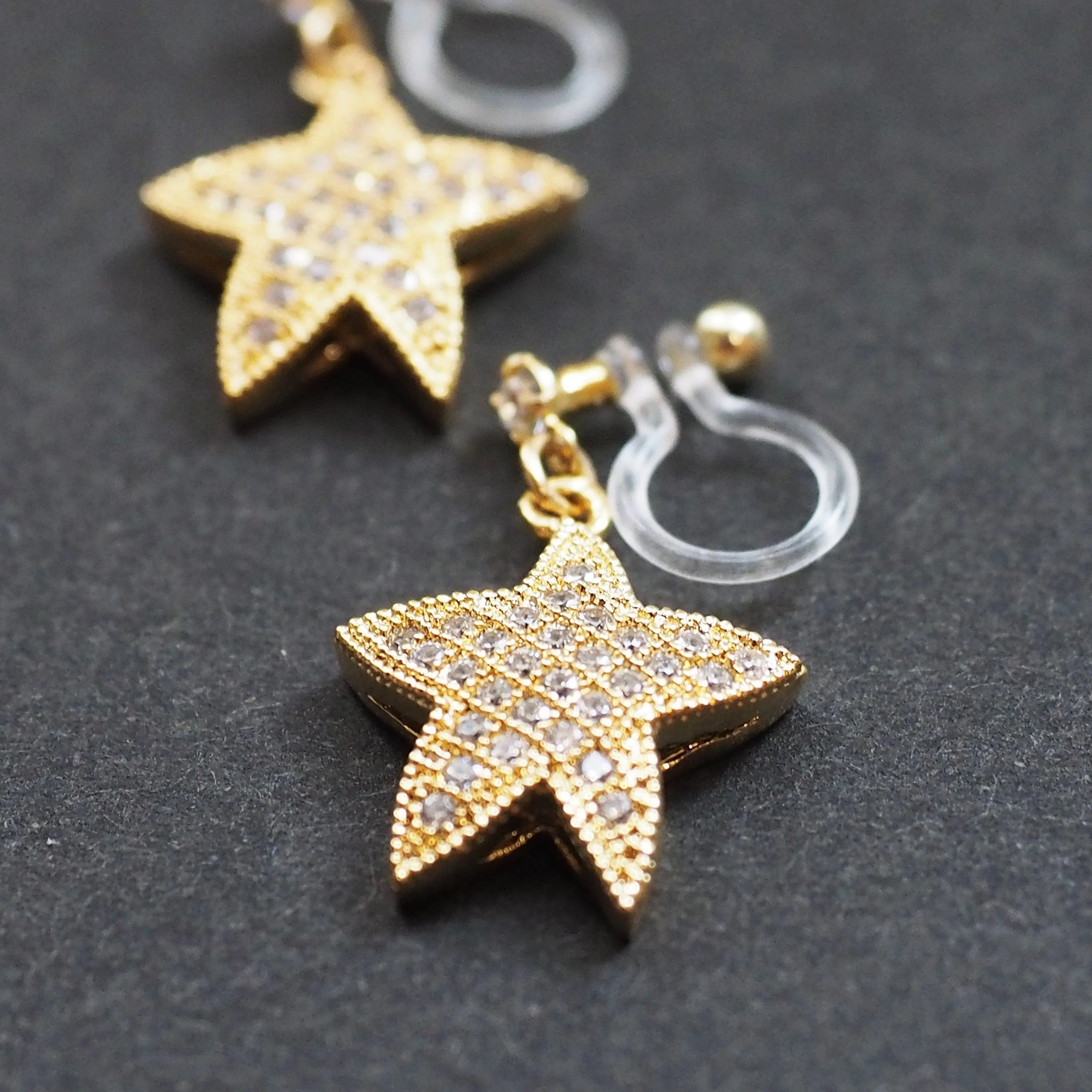 Star micro pave cubic zirconia invisible clip on earrings ( gold tone )