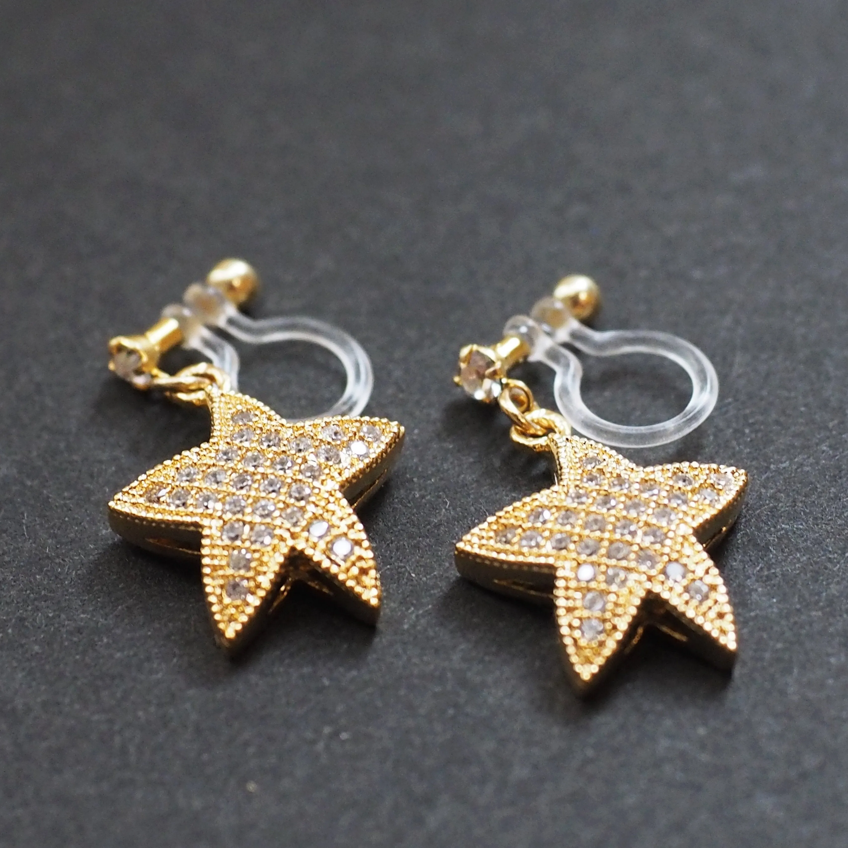 Star micro pave cubic zirconia invisible clip on earrings ( gold tone )