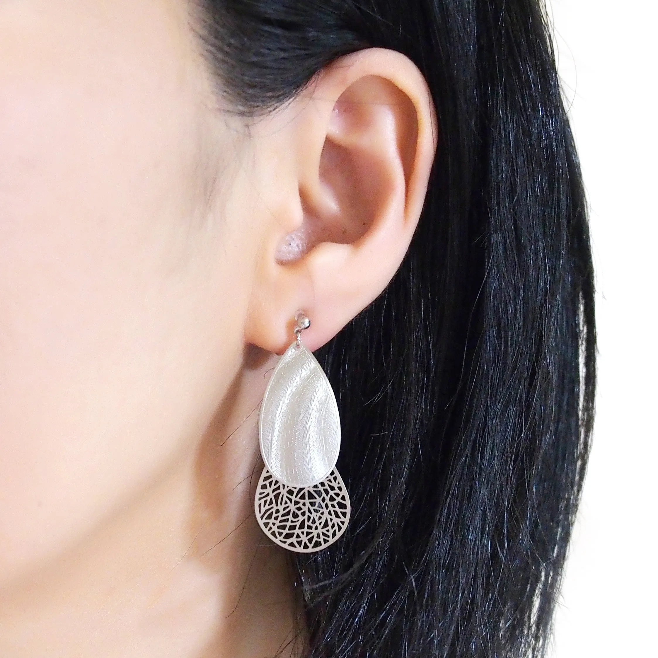 Textured  silver metal and teardrop filigree invisible clip on earrings